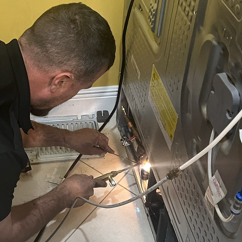 Servicing the Compressor on a Refrigerator in Broward County